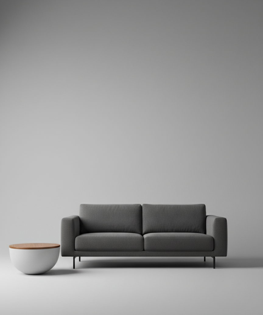 Lorien Side Table with round timber top and white fibreglass base beside a grey sofa